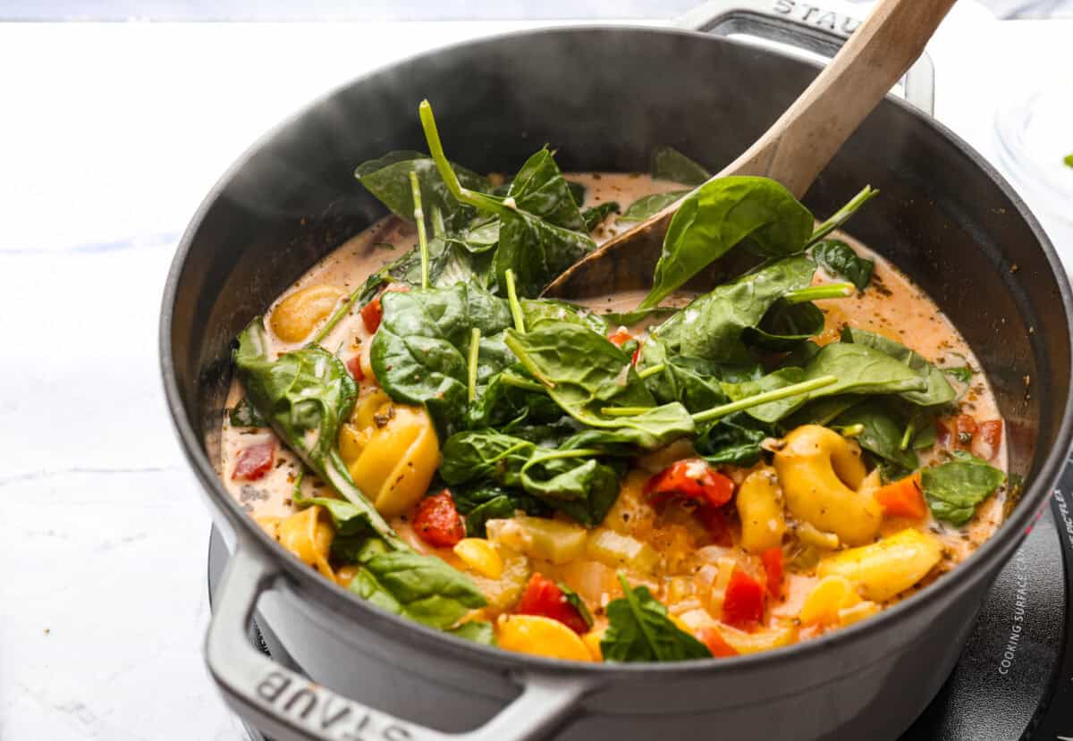 Cream, cheese and spinach added to the soup.