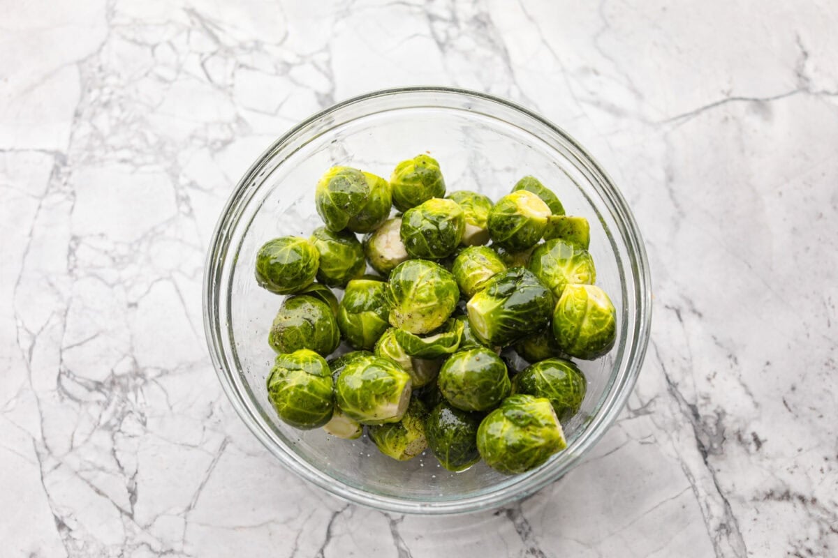 Bowl of washed and trimmed Brussels sprouts. 
