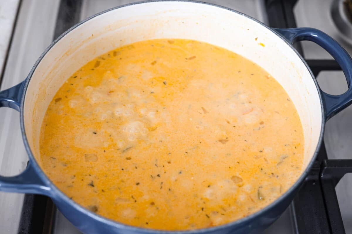 Cream cheese added to the broth mixture to make it creamy. 