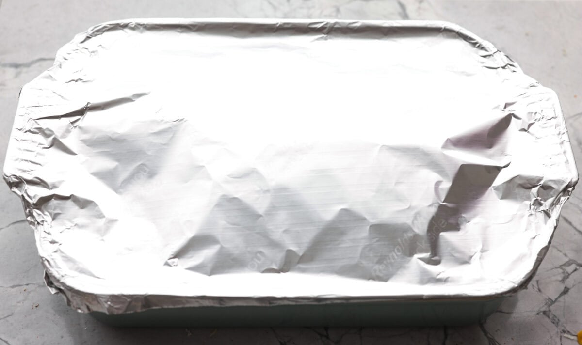 Aluminum foil wrapped over the top of the baking dish.