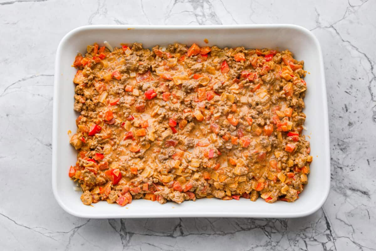 Meat mixture added to the top of the chips and cheese. 