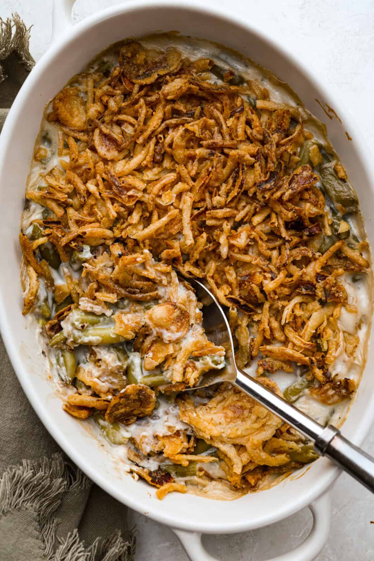 Overhead shot of baked 5 ingredient green bean casserole in the baking dish. 