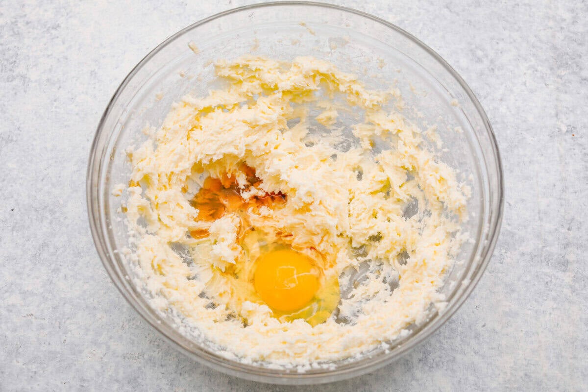 Egg and vanilla added to the beaten  butter and sugar. 