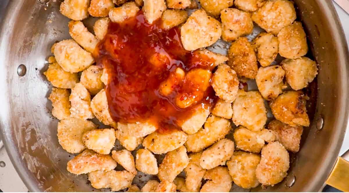 Sweet chili sauce added to the pan fried chicken. 