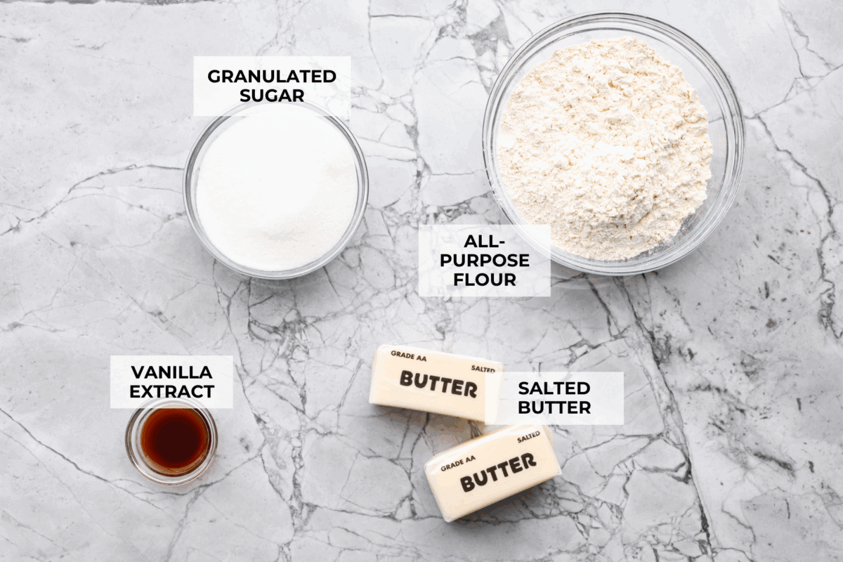 Overhead shot of labeled 4 ingredient sugar cookie ingredients.