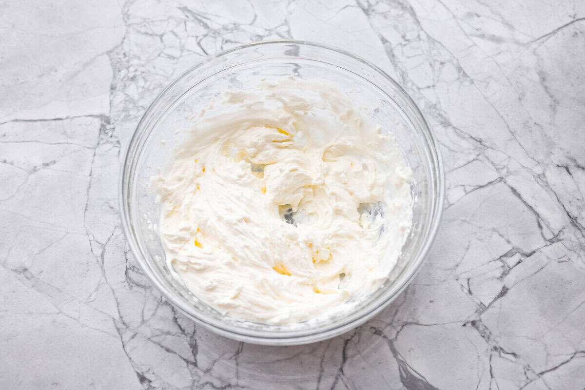 Whipping cream whipped to stiff peaks.