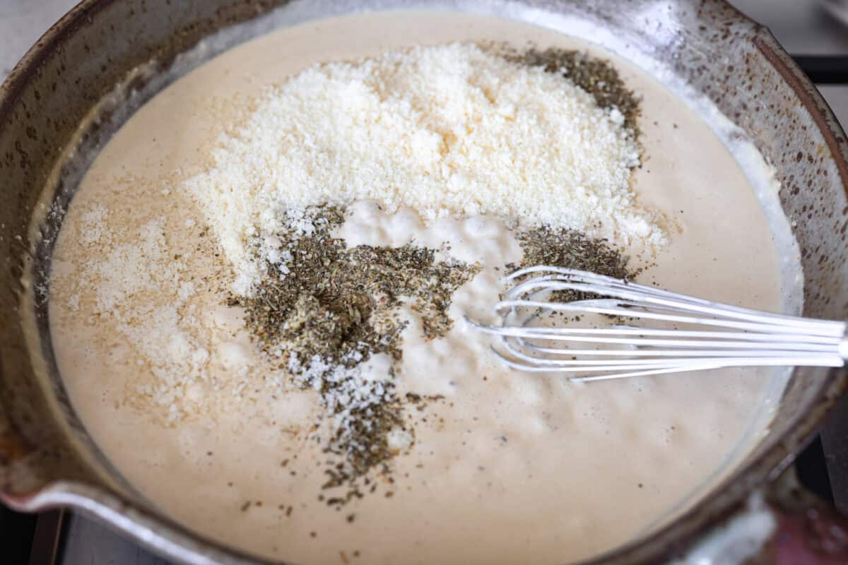 Cream cheese, Dijon, seasonings, and parmesan cheese added to the sauce. 