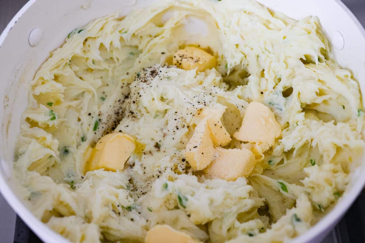 Butter, salt, and pepper added to the mashed potatoes. 