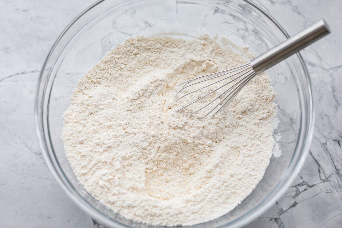 Dry ingredients added to a large mixing bowl. 
