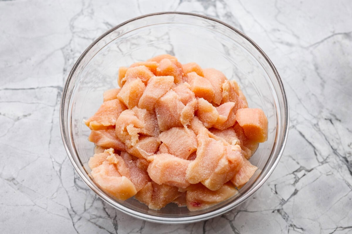 Bowl of seasoned diced chicken breast. 