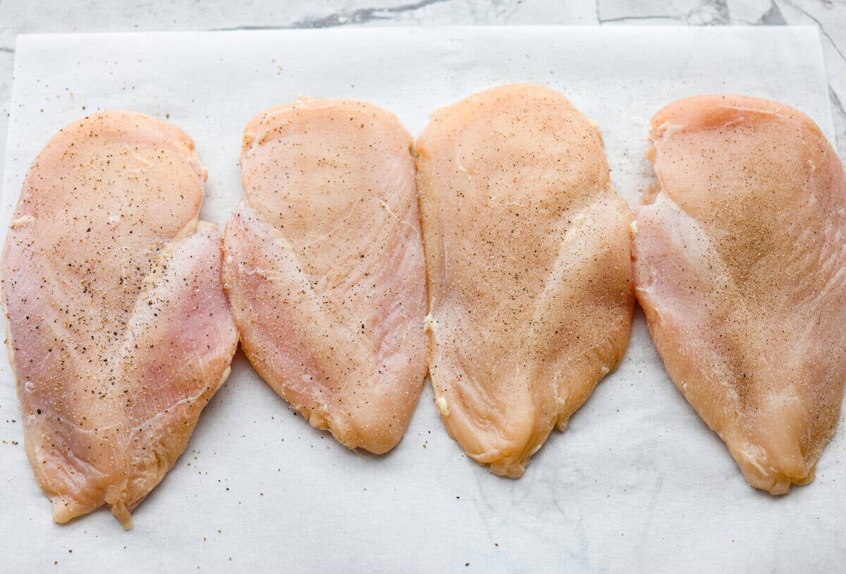 Chicken pounded and seasoned with salt and pepper. 