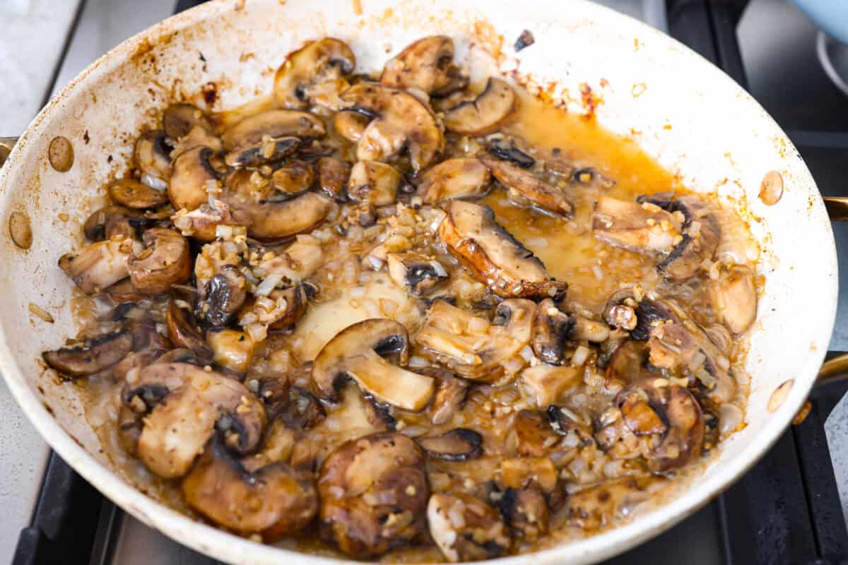 Brandy or cognac added to the mushroom mixture. 
